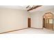 Bright living room with vaulted ceilings, skylights, a ceiling fan and a door to the entryway at 1575 N Ridge Lake Cir, Longwood, FL 32750