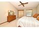 Tranquil main bedroom with ceiling fan, dresser, and ample natural light, creating a relaxing retreat at 1575 N Ridge Lake Cir, Longwood, FL 32750