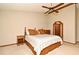 Comfortable bedroom features a ceiling fan, wood furniture, and neutral walls creating a serene atmosphere at 1575 N Ridge Lake Cir, Longwood, FL 32750