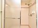 This bathroom features a shower with a sliding glass door and shower head at 1575 N Ridge Lake Cir, Longwood, FL 32750