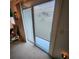 Modern sliding door with venetian blinds leading to outdoor space at 16922 Se 81St Charlesfort Ave, The Villages, FL 32162