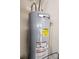 Close-up of a grey AC Smith water heater with various labels and a copper pipe at 16922 Se 81St Charlesfort Ave, The Villages, FL 32162