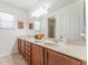 Spacious bathroom featuring a double sink vanity and large mirror at 1778 Waterside Oaks Dr, Orange City, FL 32763