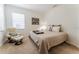 Cozy bedroom with chair, comfortable bed, soft textures, and serene decor at 1778 Waterside Oaks Dr, Orange City, FL 32763