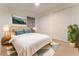 Bright bedroom with a white comforter, a plant, and a large closet at 1778 Waterside Oaks Dr, Orange City, FL 32763