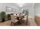 Bright dining room featuring a wooden table set, stylish chairs, and elegant decor for inviting gatherings at 1778 Waterside Oaks Dr, Orange City, FL 32763