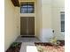 Inviting home entrance with double doors, stone pathway, and manicured landscaping at 1778 Waterside Oaks Dr, Orange City, FL 32763