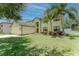 Lovely two-story home boasts a well-maintained lawn, mature trees, and attached garage at 1778 Waterside Oaks Dr, Orange City, FL 32763