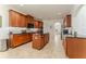 Modern kitchen showcasing wood cabinets, granite counters and tiled floors at 1778 Waterside Oaks Dr, Orange City, FL 32763