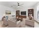 Spacious living room with modern decor, featuring comfortable seating and natural light at 1778 Waterside Oaks Dr, Orange City, FL 32763