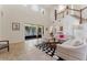 Spacious living room featuring tile floors, a large window, and comfortable seating with a black and white rug at 1778 Waterside Oaks Dr, Orange City, FL 32763