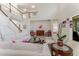 Bright living room with staircase, tile flooring, and large windows, creating a bright, airy atmosphere at 1778 Waterside Oaks Dr, Orange City, FL 32763