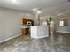 Bright kitchen featuring tile floors, white appliances, and oak cabinets at 1912 Conch Ln, Kissimmee, FL 34759