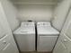 Laundry closet with a washer and dryer at 1912 Conch Ln, Kissimmee, FL 34759