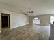 Spacious living room with vaulted ceilings, tile flooring, and an open layout at 1912 Conch Ln, Kissimmee, FL 34759