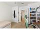 This bedroom has carpeted floors, a ceiling fan, a window, and a desk area at 1975 Cacutta Way, Kissimmee, FL 34744