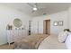 Bright bedroom with a large dresser, soft carpet, and a ceiling fan at 1975 Cacutta Way, Kissimmee, FL 34744