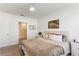 Inviting bedroom featuring a queen bed, soft neutral tones, and an en-suite bathroom for added privacy at 1975 Cacutta Way, Kissimmee, FL 34744