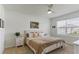Serene bedroom featuring a comfortable bed, side tables, and natural light, creating a relaxing atmosphere at 1975 Cacutta Way, Kissimmee, FL 34744