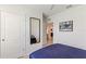This bedroom has carpeted floors, two doors and a full length mirror at 1975 Cacutta Way, Kissimmee, FL 34744