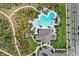 Aerial view of a clover shaped community pool featuring walking paths, a playground, and ample seating at 1975 Cacutta Way, Kissimmee, FL 34744
