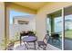 Cozy covered patio with outdoor seating and a view of the fenced yard at 1975 Cacutta Way, Kissimmee, FL 34744