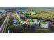 Aerial perspective of a home nestled in a quiet neighborhood with mature trees and well-kept lawns at 2019 Wintermere Pointe Dr, Winter Garden, FL 34787