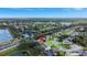 Aerial view showcasing a home near a tranquil lake, offering serene living with nature views at 2019 Wintermere Pointe Dr, Winter Garden, FL 34787