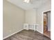 Bedroom with wood-look flooring, built-in desk, and a ceiling fan at 2019 Wintermere Pointe Dr, Winter Garden, FL 34787