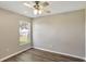 Bedroom featuring wood-look flooring, neutral walls, and a ceiling fan at 2019 Wintermere Pointe Dr, Winter Garden, FL 34787