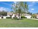 Charming home with a well-maintained front yard, lush landscaping, and a inviting curb appeal at 2019 Wintermere Pointe Dr, Winter Garden, FL 34787
