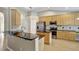 Well-equipped kitchen features stainless steel appliances, granite countertops, and ample cabinetry at 2019 Wintermere Pointe Dr, Winter Garden, FL 34787