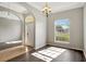 Living room featuring hardwood floors, high ceilings, and ample natural light at 2019 Wintermere Pointe Dr, Winter Garden, FL 34787