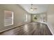 Spacious living room with vaulted ceilings, wood-look floors and plenty of natural light at 2019 Wintermere Pointe Dr, Winter Garden, FL 34787