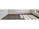 Neutral room with dark wood flooring and ample natural light from the window at 2019 Wintermere Pointe Dr, Winter Garden, FL 34787