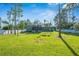 Expansive backyard with lush green grass and a privacy fence, perfect for outdoor activities at 2049 Eldorado Ct, St Cloud, FL 34771