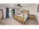 Classic bedroom with a golden wood bed frame, matching nightstands, and calming blue accents at 2049 Eldorado Ct, St Cloud, FL 34771