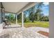 Welcoming front porch with stone pavers, providing a comfortable outdoor seating area at 2049 Eldorado Ct, St Cloud, FL 34771