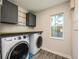 Laundry room with washer and dryer, cabinets and window at 2049 Eldorado Ct, St Cloud, FL 34771