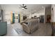 Open concept living space with modern decor, vaulted ceilings, and seamless flow to the kitchen area at 2049 Eldorado Ct, St Cloud, FL 34771