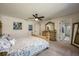 Main bedroom with dresser, ensuite bath, and a well-lit space at 2049 Eldorado Ct, St Cloud, FL 34771