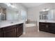 Luxurious bathroom boasts dual vanities, a soaking tub, and separate shower, providing a spa-like experience at 217 Victoria Trails Blvd, Deland, FL 32724