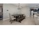 Cozy dining area adjacent to kitchen with modern chandelier and stylish furnishings at 217 Victoria Trails Blvd, Deland, FL 32724