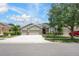 Charming single-Gathering home boasts a three-car garage and well-manicured front yard landscaping at 217 Victoria Trails Blvd, Deland, FL 32724