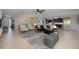Open-concept living room featuring modern decor, tile flooring, and lots of natural light at 217 Victoria Trails Blvd, Deland, FL 32724