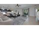 Inviting living room with tile floors, a plush sofa, and sliding glass doors to the patio at 217 Victoria Trails Blvd, Deland, FL 32724