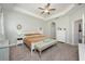 Spacious primary bedroom offers a tray ceiling, ceiling fan, and decorative touches, creating a peaceful retreat at 217 Victoria Trails Blvd, Deland, FL 32724