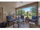 Relaxing screened-in patio featuring wicker seating and views of the backyard at 217 Victoria Trails Blvd, Deland, FL 32724