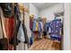 Walk-in closet with clothing rack, shelves, and hardwood floor at 2217 Caledonian St, Clermont, FL 34711