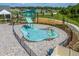 Aerial view of community splash pad with water features, surrounded by green space at 2897 Elio Hammock Dr, St Cloud, FL 34773